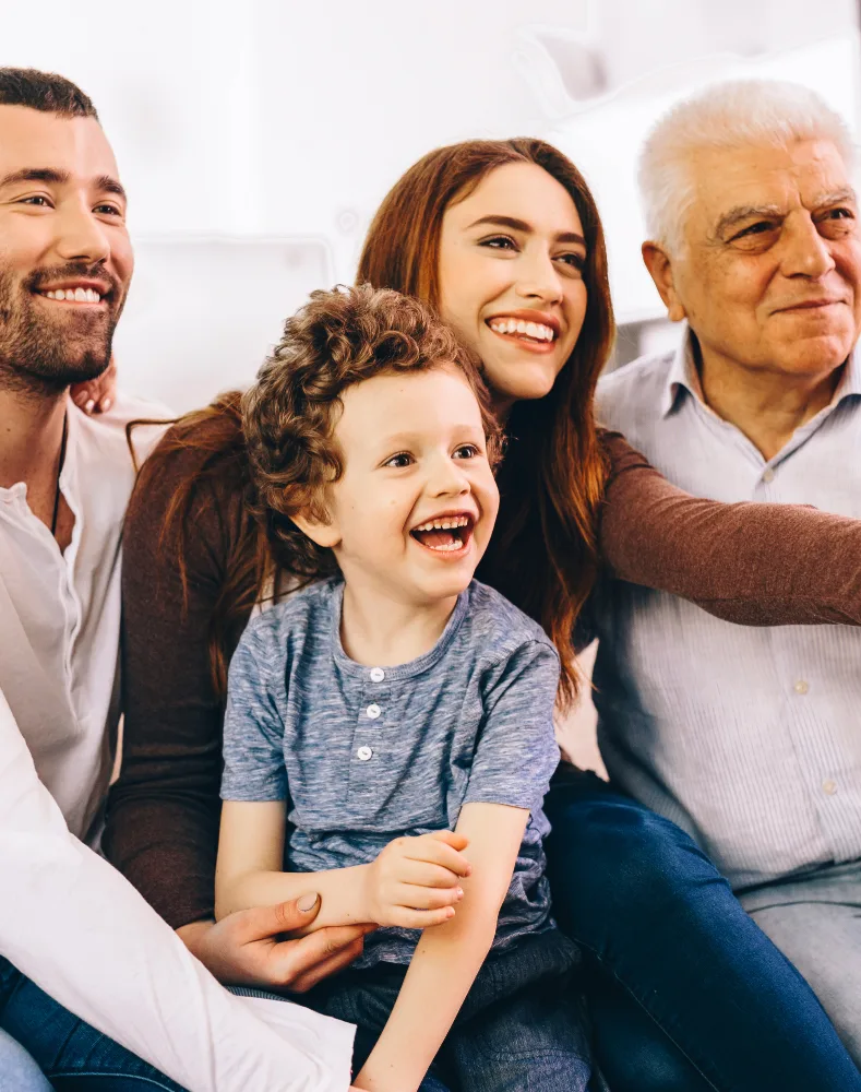 family sitting together and smiling